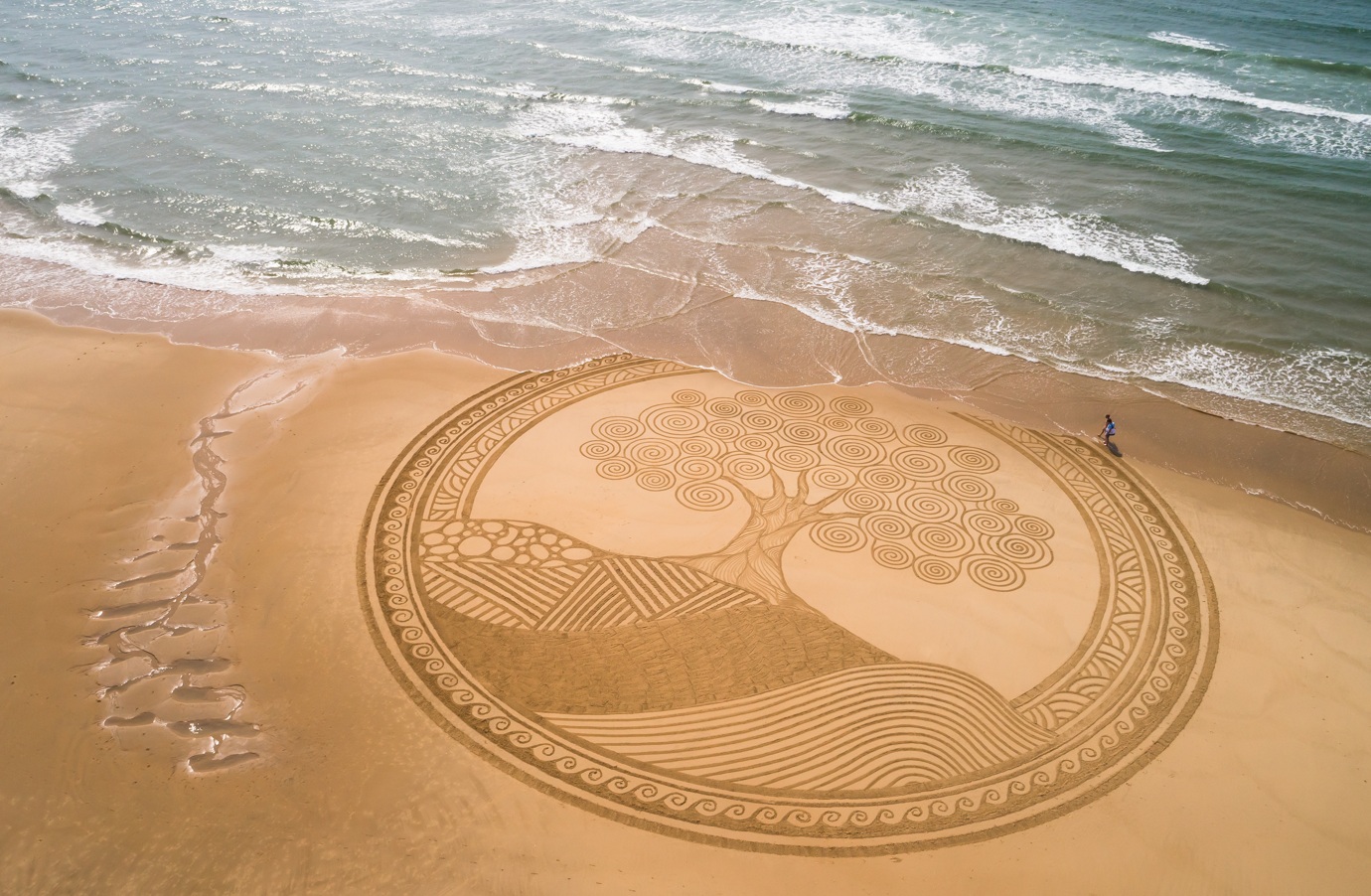 dessin sur le sable